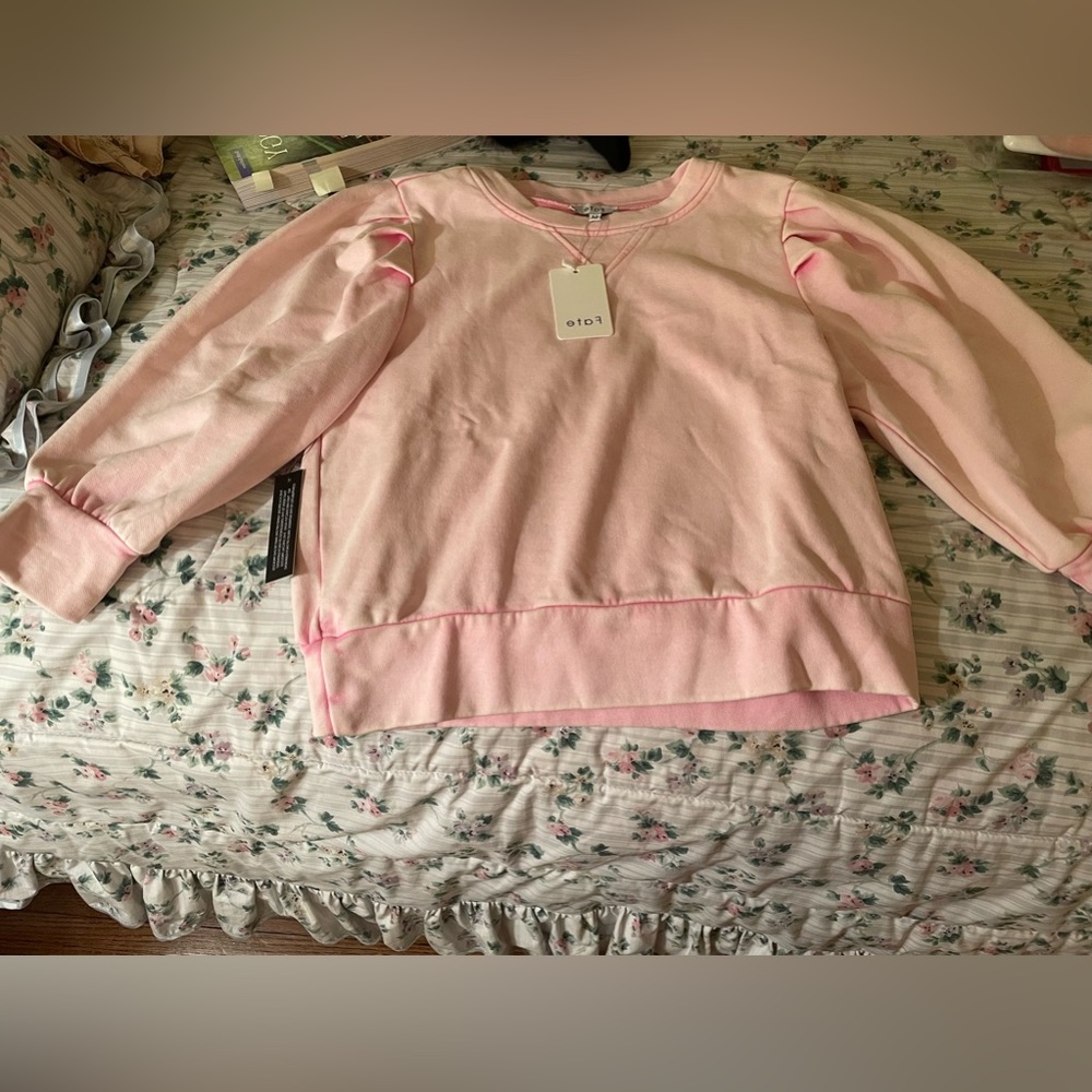 Pink fluted sleeve sweatshirt. Never worn. Still has tags on it.